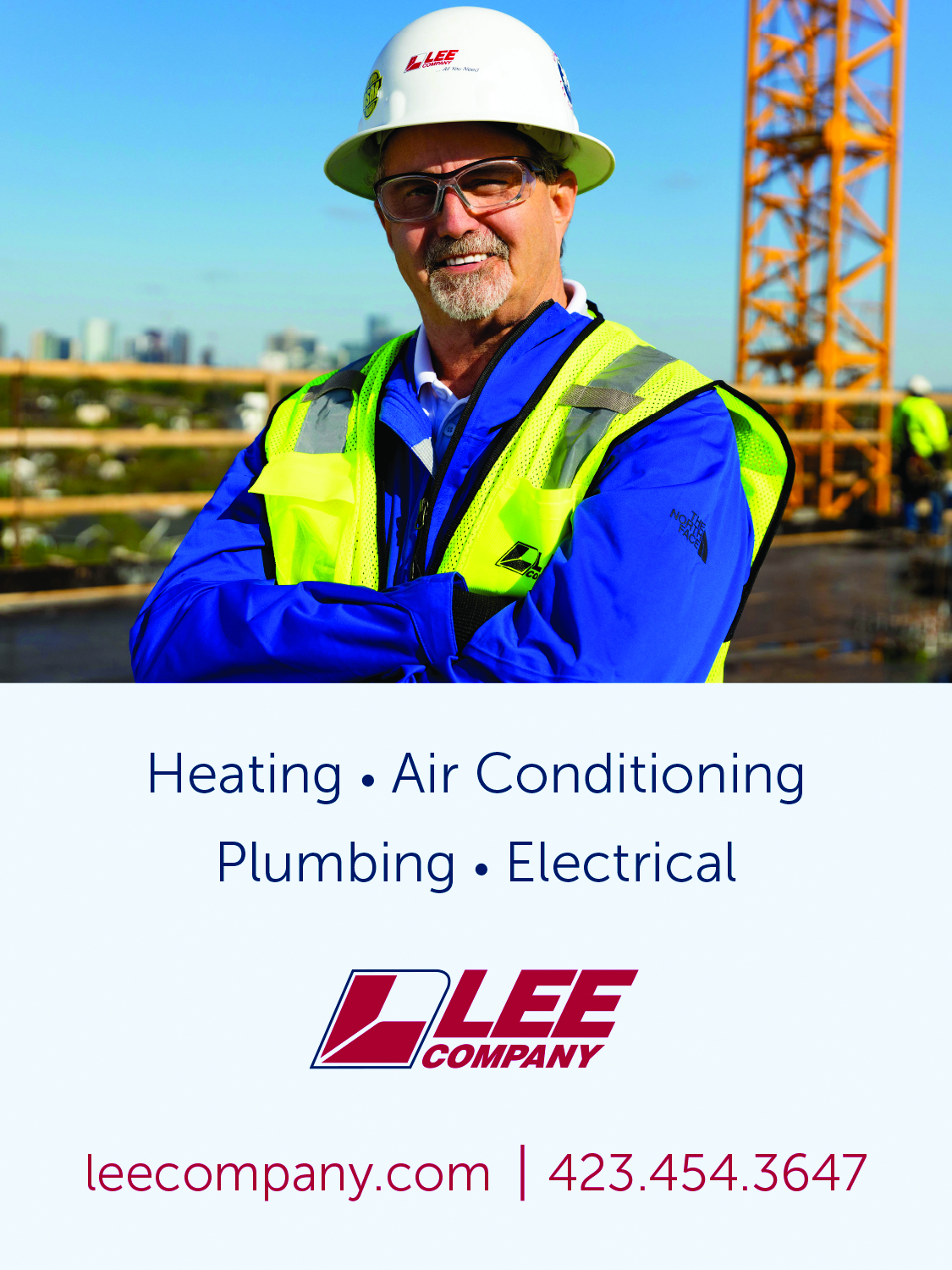 Smiling worker in safety vest at construction site for HVAC and plumbing services. Smiling worker in safety vest at construction site for HVAC and plumbing services.